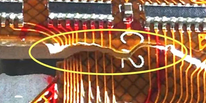 Flex PCB with manufacturing defects like delamination and trace cracking.